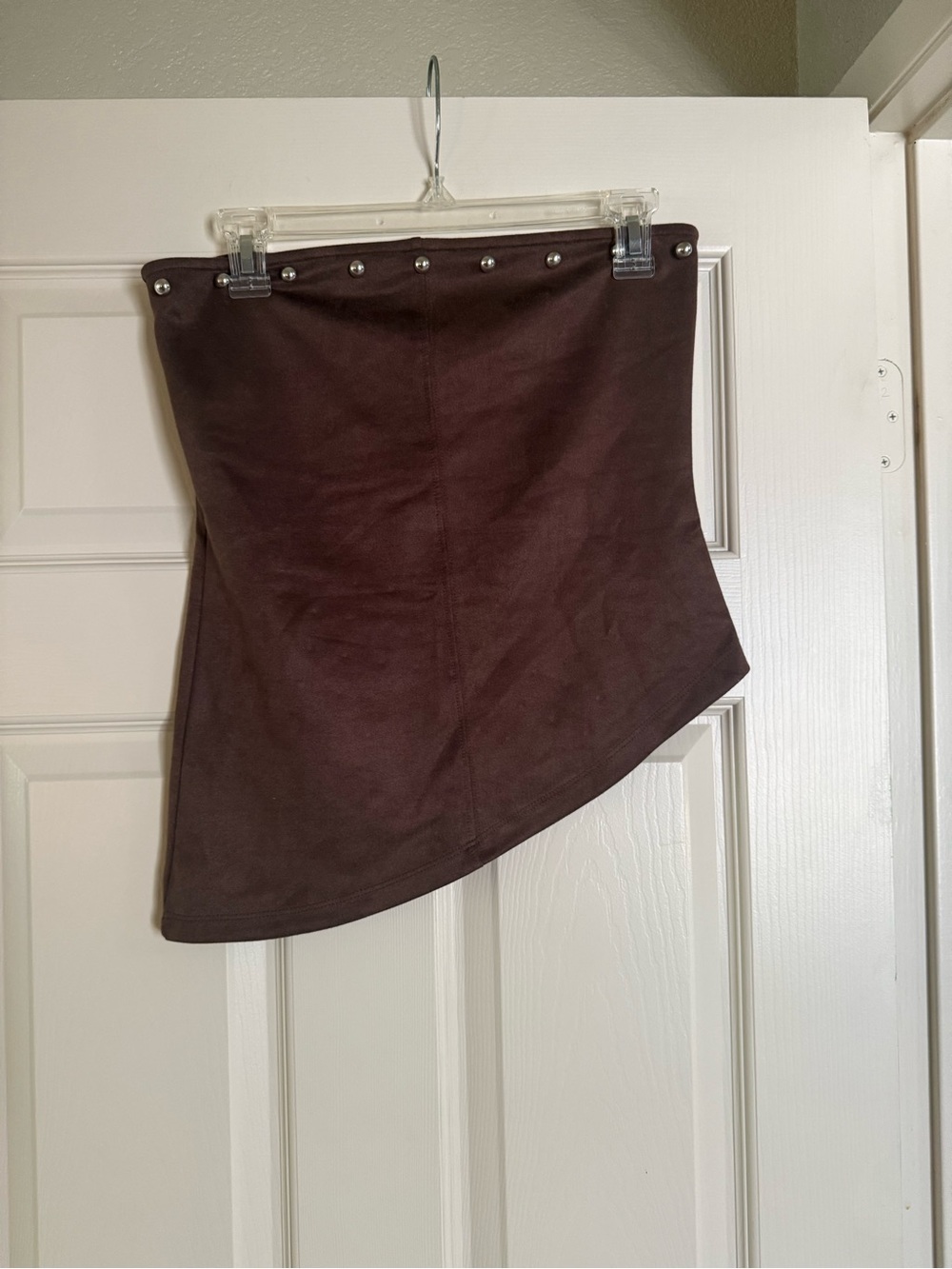 Brown Asymmetric faux suede strapless top.